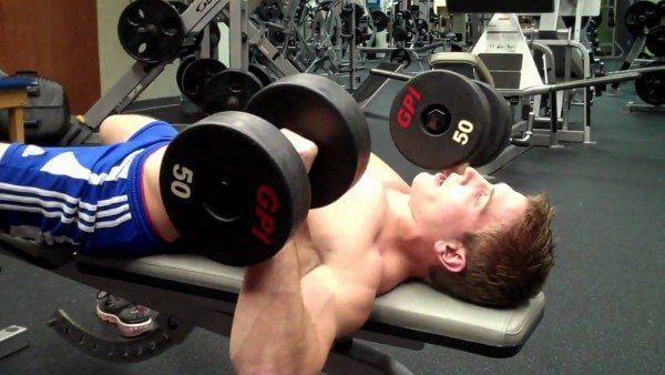 The Dumbbell Bench Press is a great exercise, but you need to take care to do it correctly.